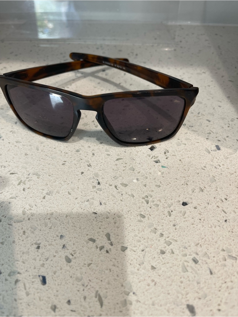 Oakley Tortoise Shell Sunglasses with Dark Gray Lenses